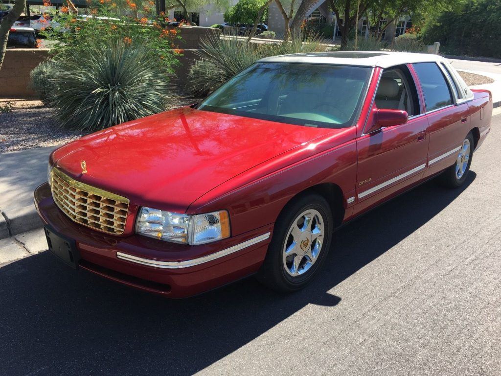 Shining red 1999 Cadillac DeVille with only 19k original miles