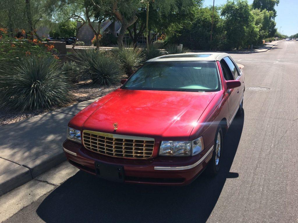Shining red 1999 Cadillac DeVille with only 19k original miles